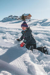 Child playing in the snow